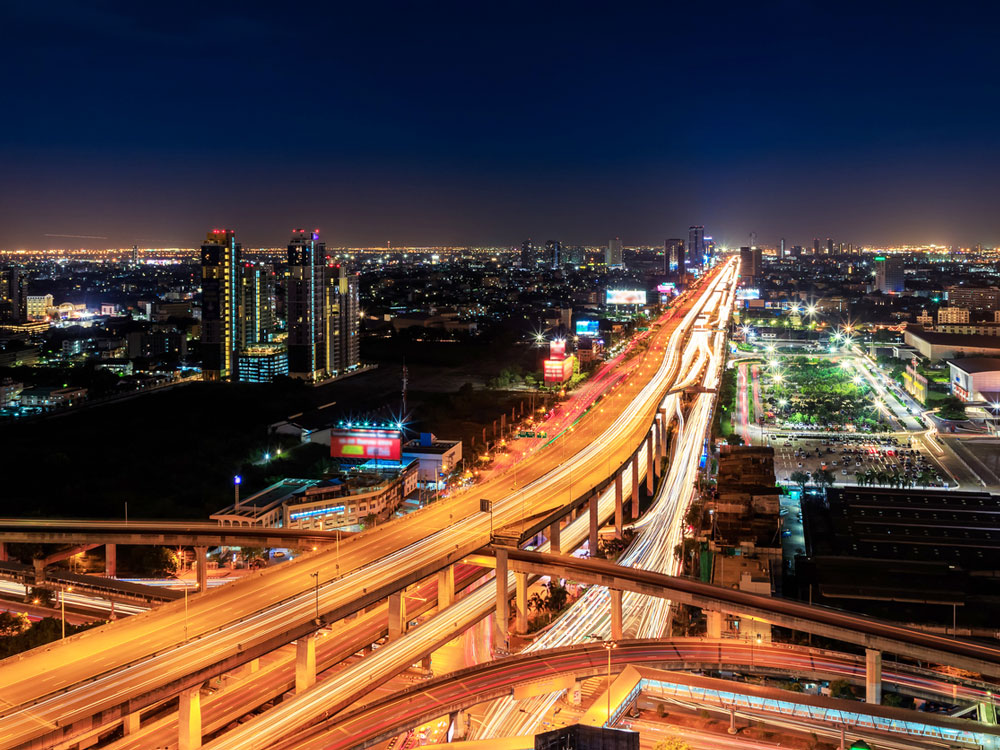 Aerial time-lapse shot of Thailand's Bang Na Expressway at night