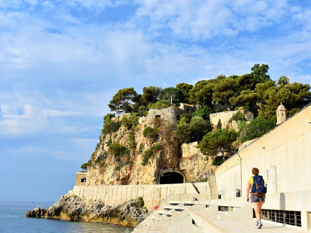 Person walking along coastal path in Monaco