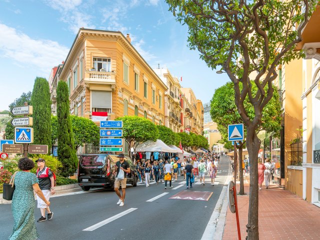 Pedestrians walking on busy street in Monaco