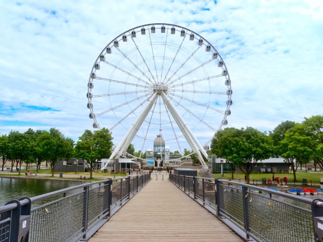 Bridge leading to Ferris wheel in Old Montreal neighborhood of Montreal, Canada