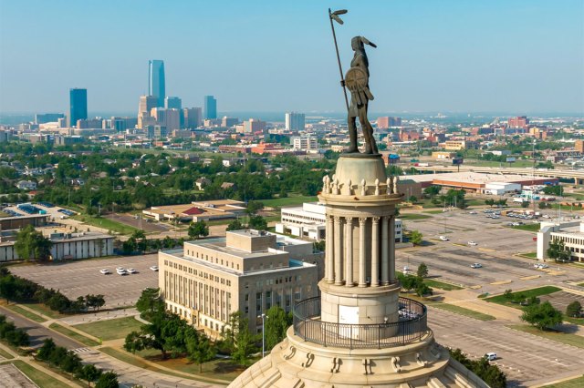 Statue atop Oklahoma state house overlooking Oklahoma City