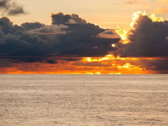 Long clouds over the Gulf of Carpentaria in Australia at sunset