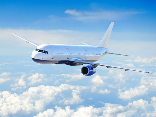 Airplane during cruise above clouds