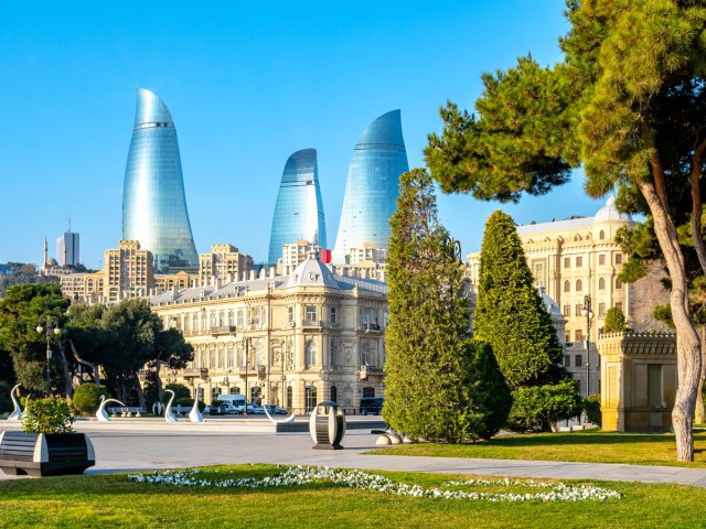 Urban park with view of traditional and modern skyscrapers in Baku, Azerbaijan